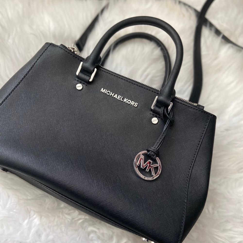 Lightly used Michael Kors medium black crossbody